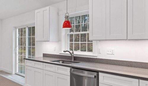 interior-of-a-kitchen-with-white-cabinets-a-red-h-2023-03-06-18-04-57-utc